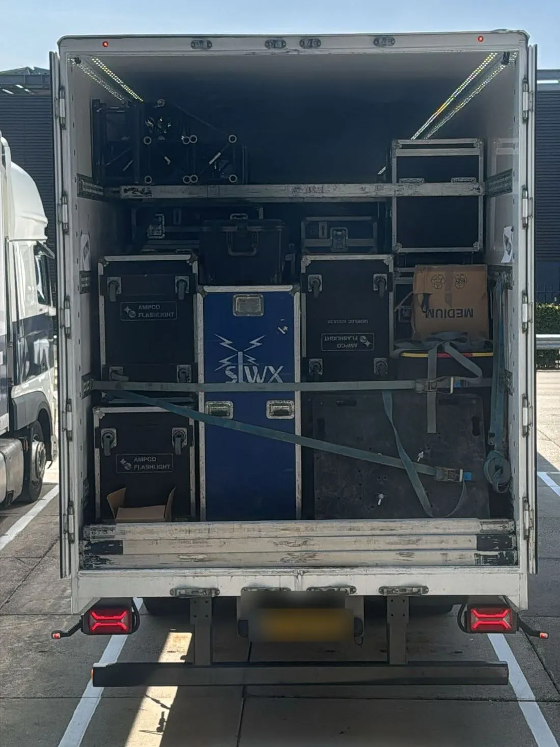 Rear of a truck packed with Soulwax flight cases and truss